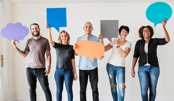 People carrying speech bubble icons