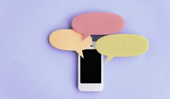 mobile phone with multiple speech bubbles