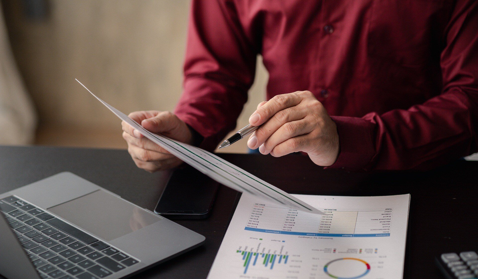 Business men are looking at the company's financial documents to analyze problems and find solutions